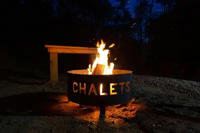 a fire pit with a sign that says chiles at Legends Lane E - by The Chalets in Logan