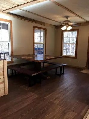a large dining room with a large table in a room at Stunning Getaway Cabin with Expansive Decks near Huntington, West Virginia in Genoa