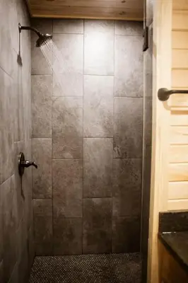 a bathroom with a shower with a glass door at Middlefork Ridge Entire Property in Laurelville