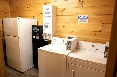 a kitchen with two refrigerators and a refrigerator at Lovely Rural Cabin Nestled Among Nature by Tappan Lake in Ohio in Deersville