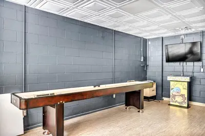 a ping pong table in a room with a tv at Cozy Secluded Cabin with Games and Hot-tub in Sarahsville, Ohio