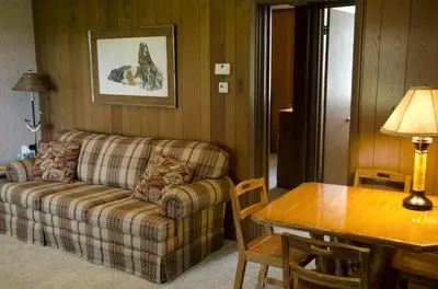 a living room with a couch and a table at Inviting Suite Rental in a Charming Farmhouse in Sandusky, Ohio in Sandusky
