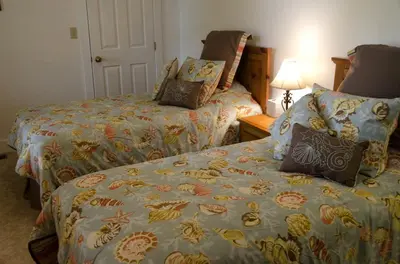a hotel room with two beds and a lamp at Inviting Suite Rental in a Charming Farmhouse in Sandusky, Ohio in Sandusky