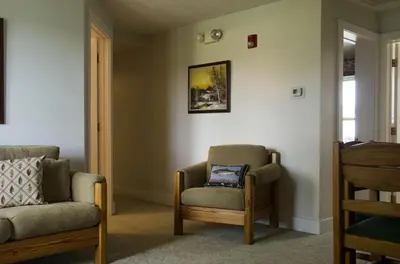 a living room with a chair and a chair at Tranquil Weekend Getaway for a Large Group near the Cuyahoga Valley National Park, Ohio in Sandusky