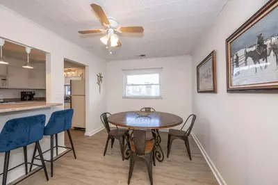 a dining room and kitchen with a table and chairs at The Grand Elm Suite 2 in Ludlow