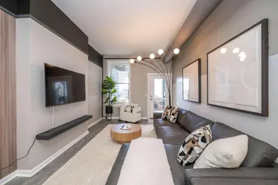 a living room with a couch and a table at Queen City Views Suites in Cincinnati