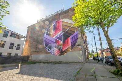 a mural on the side of a building at Findlay Market Suite 1 - For 2 in Cincinnati