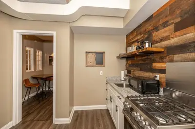 a kitchen with a stove and a counter top at Monmouth Lofts - Newport Lofts Sleep 10 in Newport