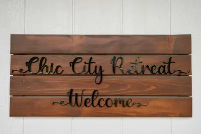 a sign that reads the thy kitchen is welcome at Chic City Retreat 93A in Columbus