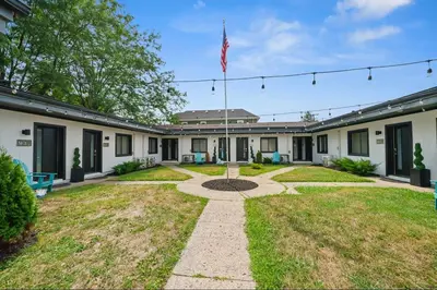 a house with an american flag in the yard at Chic City Retreat 93E in Columbus