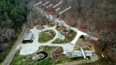 an aerial view of a farm with a truck on a field at Two Person A-frame near Tappan Lake, Ideal to Reconnect with Nature in Ohio in Deersville