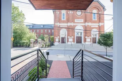 a view of a brick building from a balcony at 1BR, Next to Monastery Wedding Venue, with Bathtub in Cincinnati