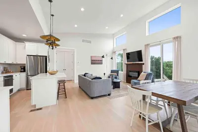a kitchen and living room with a table and a dining room at 4BR, 2 & half Bath, Hot Tub, Private Parking, Near Ark in Dry Ridge