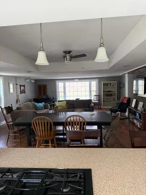 a living room with a table and a couch at Old Orchard