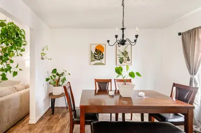a dining room with a table and chairs at Cozy boho Retreat in Grove City