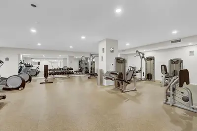 a gym with a lot of treadmills and machines at Luxury lofts, Downtown, Playhouse Sq, Near Stadium and Arena, Fire Pit, Rooftop deck, BBQ, Parking -fcfs, Close to EVERYTHIHNG! in Cleveland