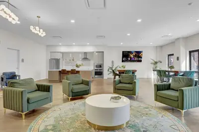 a living room with chairs and a coffee table at Luxury lofts, Downtown, Playhouse Sq, Near Stadium and Arena, Fire Pit, Rooftop deck, BBQ, Parking -fcfs, Close to EVERYTHIHNG! in Cleveland