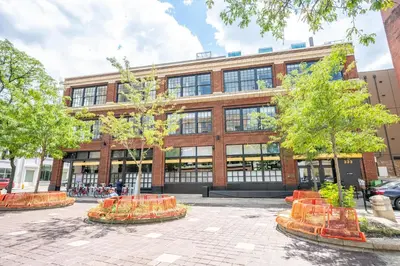 a large brick building with trees in front of it at The 333 Suites 203 - Stay for 6 in Cincinnati