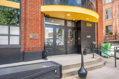 a store front of a building with a large door at The 333 Suites 203 - Stay for 6 in Cincinnati