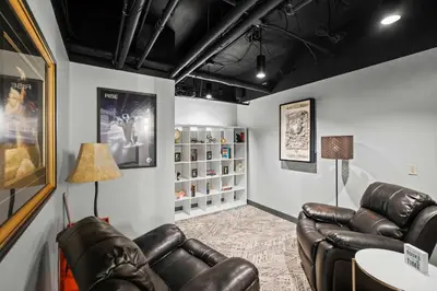 a waiting room with leather chairs and a table at The 333 Suites 204 - Stay for 2 in Cincinnati