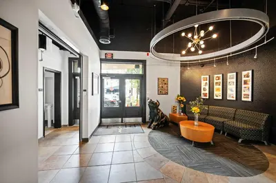 a lobby with a waiting room with a table and chairs at The 333 Suites 302 - Stay for 6 in Cincinnati