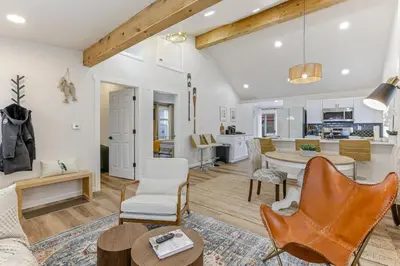 a living room and kitchen with a table and chairs at Gone Fishin in Buckeye Lake