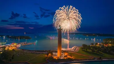 a firework display in a park with the water in the background at Put-in-Bay Island Club #21 in Put-in-Bay