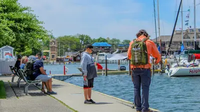 a group of people standing on a dock near the water at Put-in-Bay Island Club #109 in Put-in-Bay