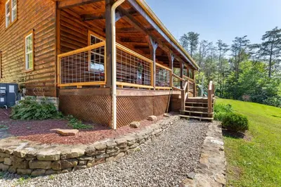 a wooden house with a porch and a stairway to it at Starry Mountain Night- Private Pool, Pool Table in Stanton