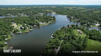 an aerial view of a lake with houses and trees at Lakefront Home with Boat Dock and Multiple Decks in Williamstown