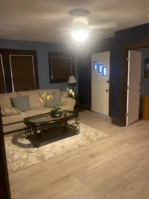 a living room with a couch and a coffee table at 1469 east 116th in Cleveland