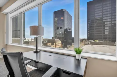 an office with a desk and a window with a view at Luxury Condo w/ Lake Views! Center of Downtown in Cleveland