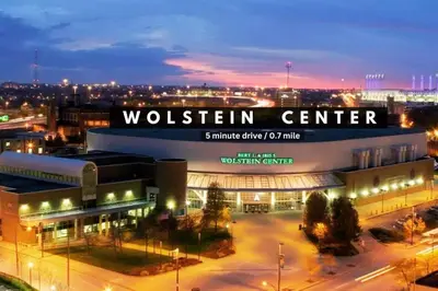 a building with a sign that reads woltten center at night at Comfy City Vibe • Theater District Gem in Cleveland
