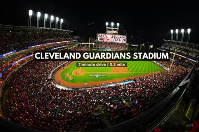 a crowd of people at a baseball game at night at Playhouse Square Suite | Downtown | Parking in Cleveland