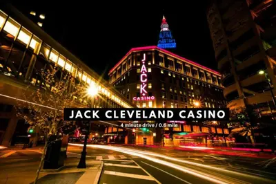 a street sign in front of a building at night at Luxury Condo in Playhouse Square: Walkers Paradise in Cleveland