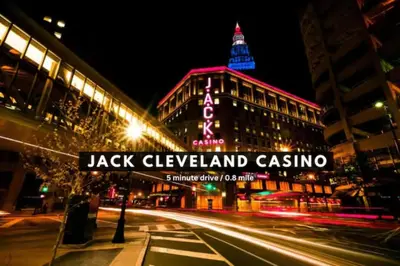a building with a sign in front of it at night at Luxury Loft • Heart of Downtown• Parking/Gym in Cleveland