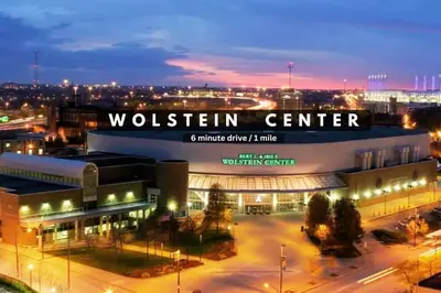 a building with a sign that reads woltten center at night at Amazing Downtown Apartment in Incredible Location! in Cleveland
