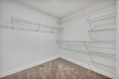 an empty room with white walls and white shelves at Modern Loft in the Heart of Cleveland | Gym in Cleveland
