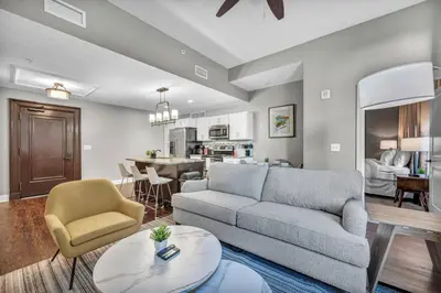 a living room with a couch and a table at Modern Loft in the Heart of Cleveland | Gym in Cleveland