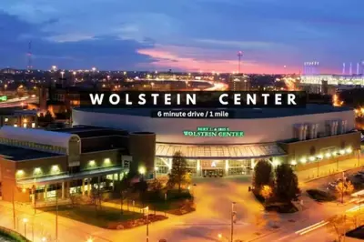 a building with a sign that reads wolfenstein center at night at Luxury 2 BD Condo in the Heart of Downtown • Gym in Cleveland