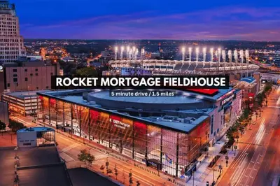 a view of a building in a city at night at Penthouse Vibes • Fun, Space & City Views in Cleveland