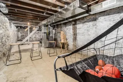 a gym with a basketball net and stools in a room at 230 Entire Complex 2 homes side by side in Columbus