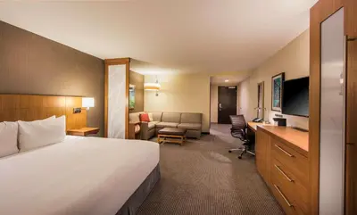 a hotel room with a large bed and a desk at Hyatt Place Cleveland/Westlake/Crocker Park in Westlake