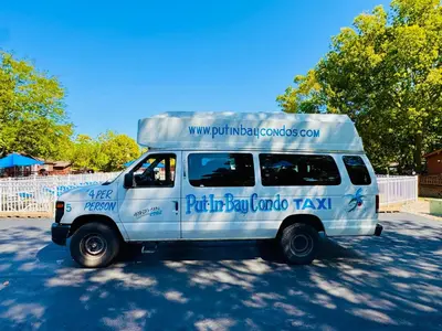 a white van parked in a parking lot at Put-in-Bay Island Club #51 in Put-in-Bay