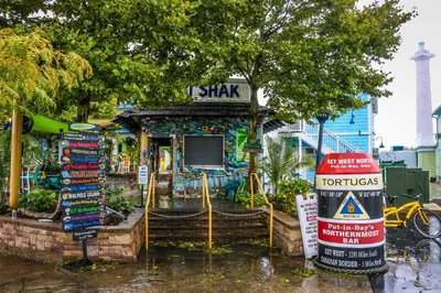 a small store with a sign in front of it at Put-in-Bay Island Club #113 in Put-in-Bay