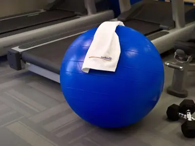a blue gym ball with a towel on it at Sonesta ES Suites Cincinnati - Sharonville East in Sharonville