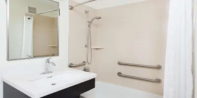 a bathroom with a sink and a shower at Sonesta Simply Suites Cleveland North Olmsted Airport in North Olmsted