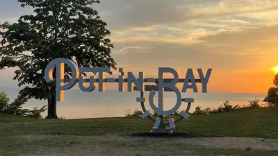 a sign for a park with the words pottery day at Put-in-Bay Island Club #111 in Put-in-Bay