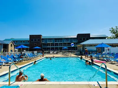 a pool at a hotel with people playing in it at Put-in-Bay Waterfront Condo #104 in Put-in-Bay