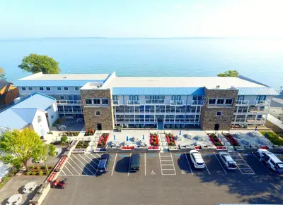 an aerial view of a hotel with a parking lot at Put-in-Bay Waterfront Condo #208 in Put-in-Bay